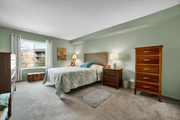 a bedroom with a bed and a television