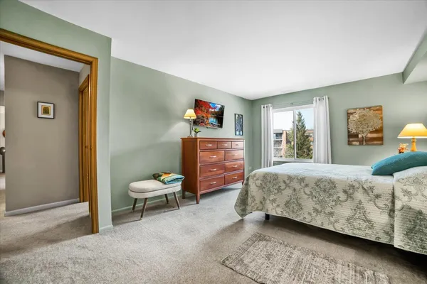 a bedroom with furniture and a window