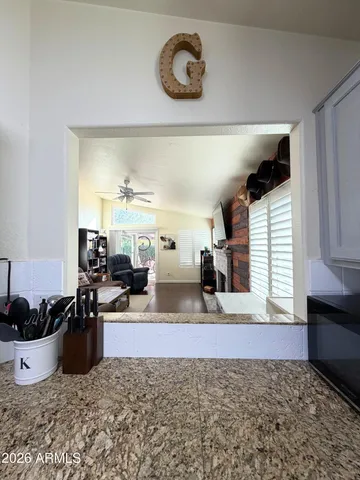 a living room with furniture a rug and a window