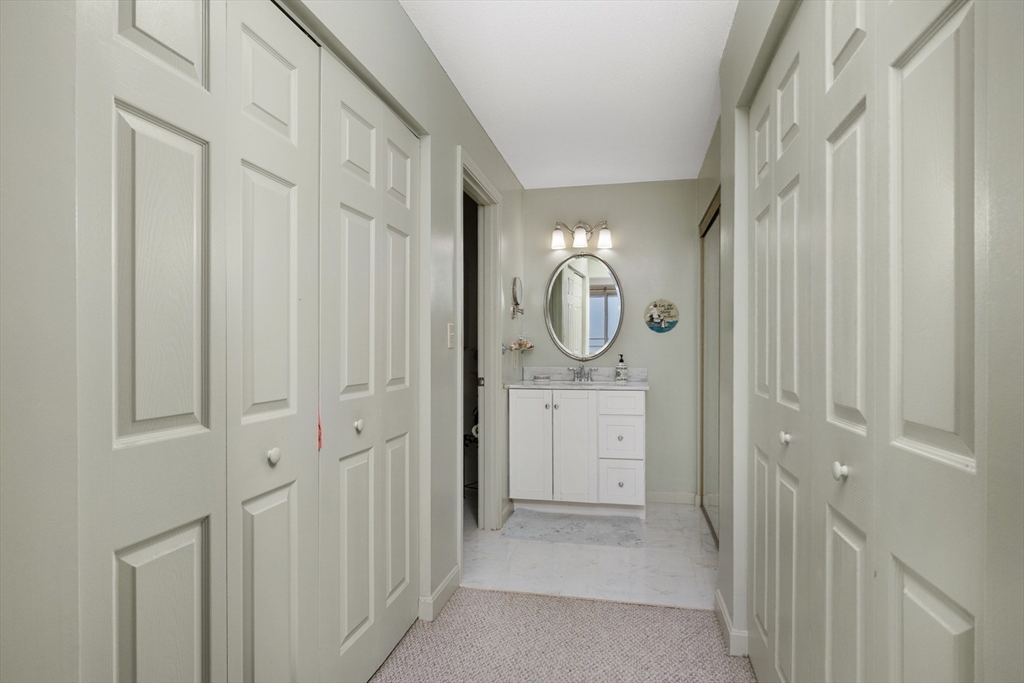 9 Park Avenue, Unit 705 Hull, MA 02045 - Photo 12 of 22 a view of a hallway with washer and dryer
