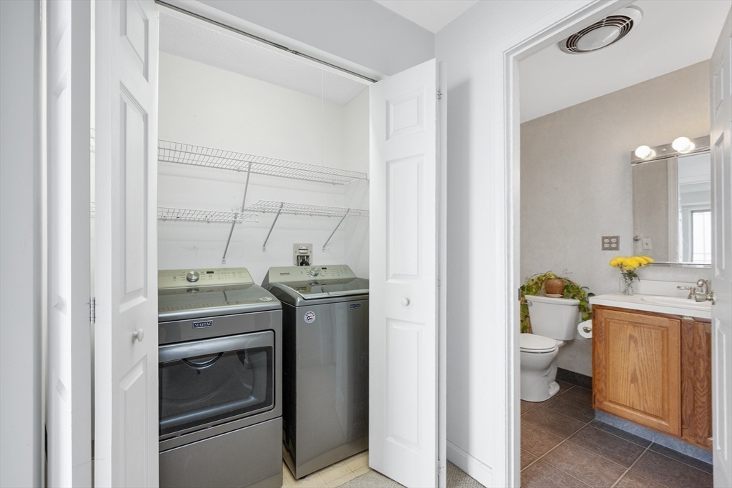 9 Park Avenue, Unit 705 Hull, MA 02045 - Photo 16 of 22 a view of bathroom with a toilet sink and mirror