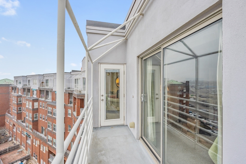 9 Park Avenue, Unit 705 Hull, MA 02045 - Photo 10 of 22 a view of a hallway with wooden cabinets and entryway
