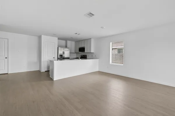 a view of a kitchen with a sink cabinets and a window