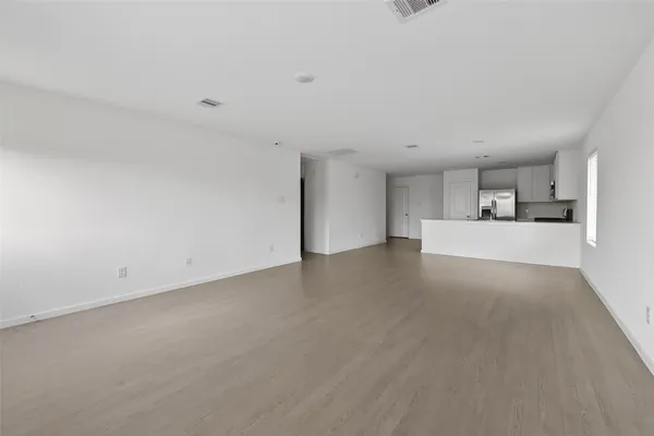 a view of a kitchen with a sink and a window