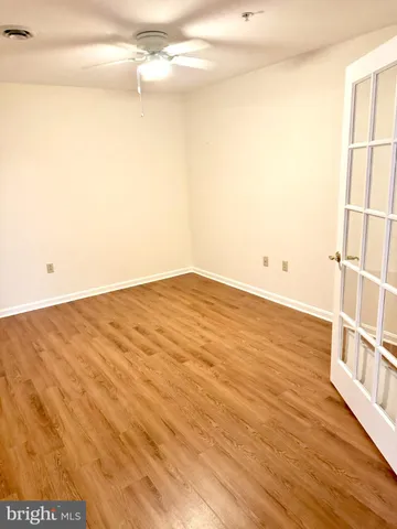 a view of a bathroom with wooden floor