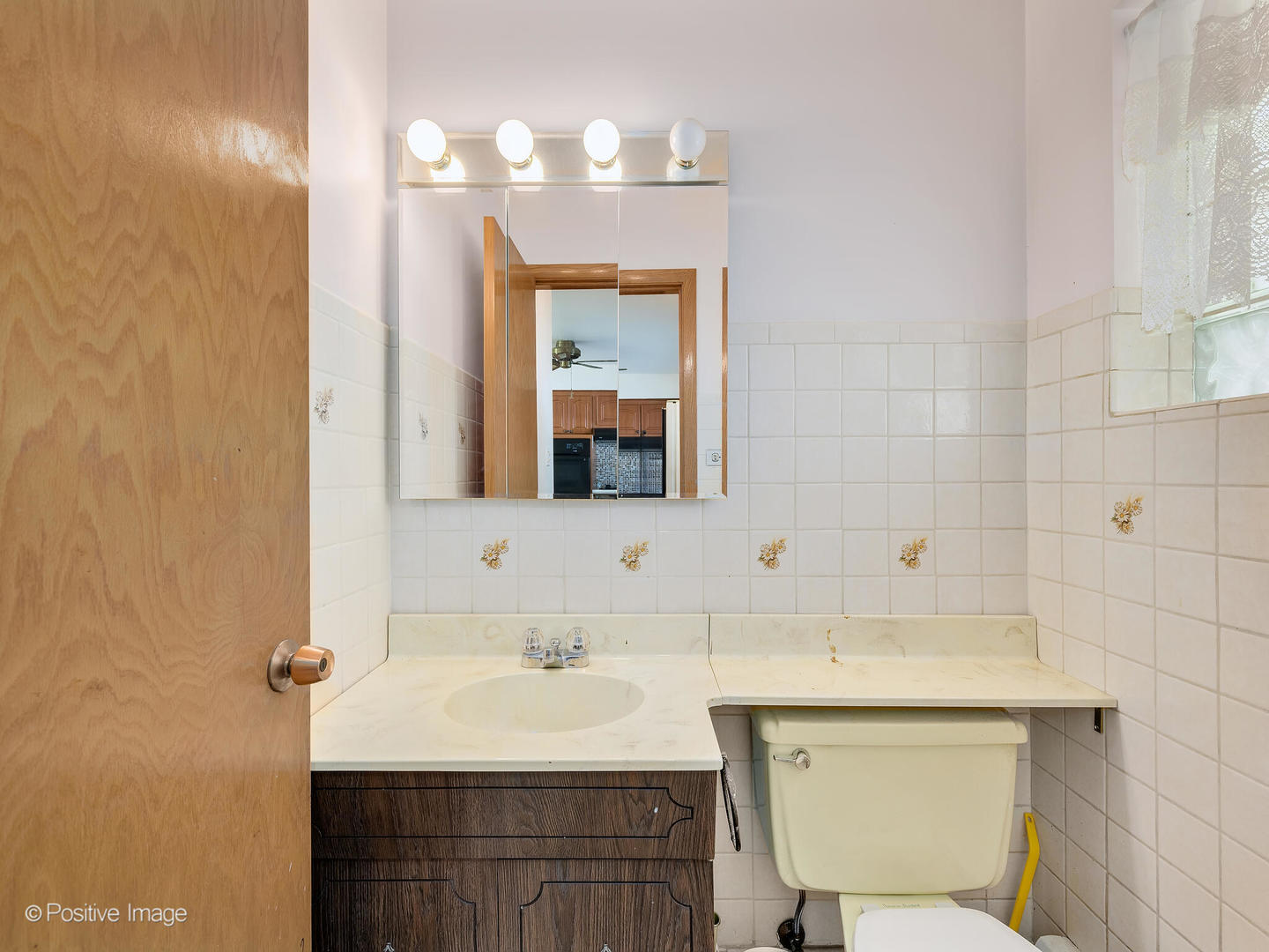 365 Olmsted Road Riverside, IL 60546 - Photo 14 of 23 a bathroom with a sink and a mirror