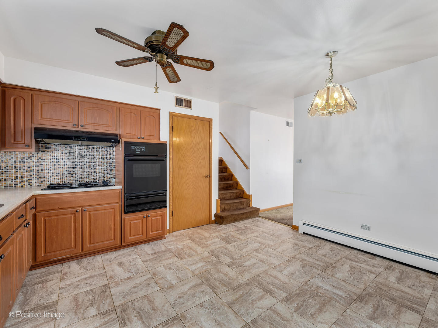 365 Olmsted Road Riverside, IL 60546 - Photo 10 of 23 a view of a kitchen with microwave and cabinets