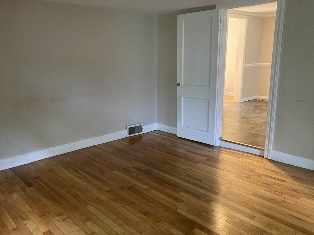 151 Ridge Road Rutland, MA 01543 - Photo 5 of 8 a view of empty room with wooden floor