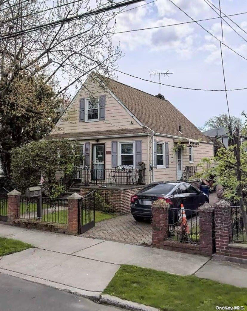 151-40 17th Road Queens, NY 11357 - Photo 1 of 1 a front view of house with yard outdoor seating and barbeque oven
