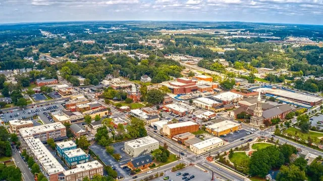 an aerial view of residential houses with outdoor space