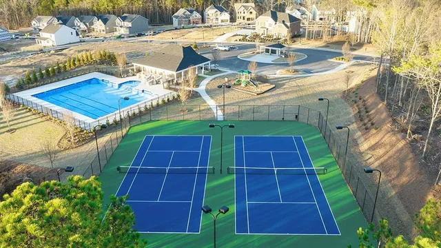 a view of a backyard with swimming pool
