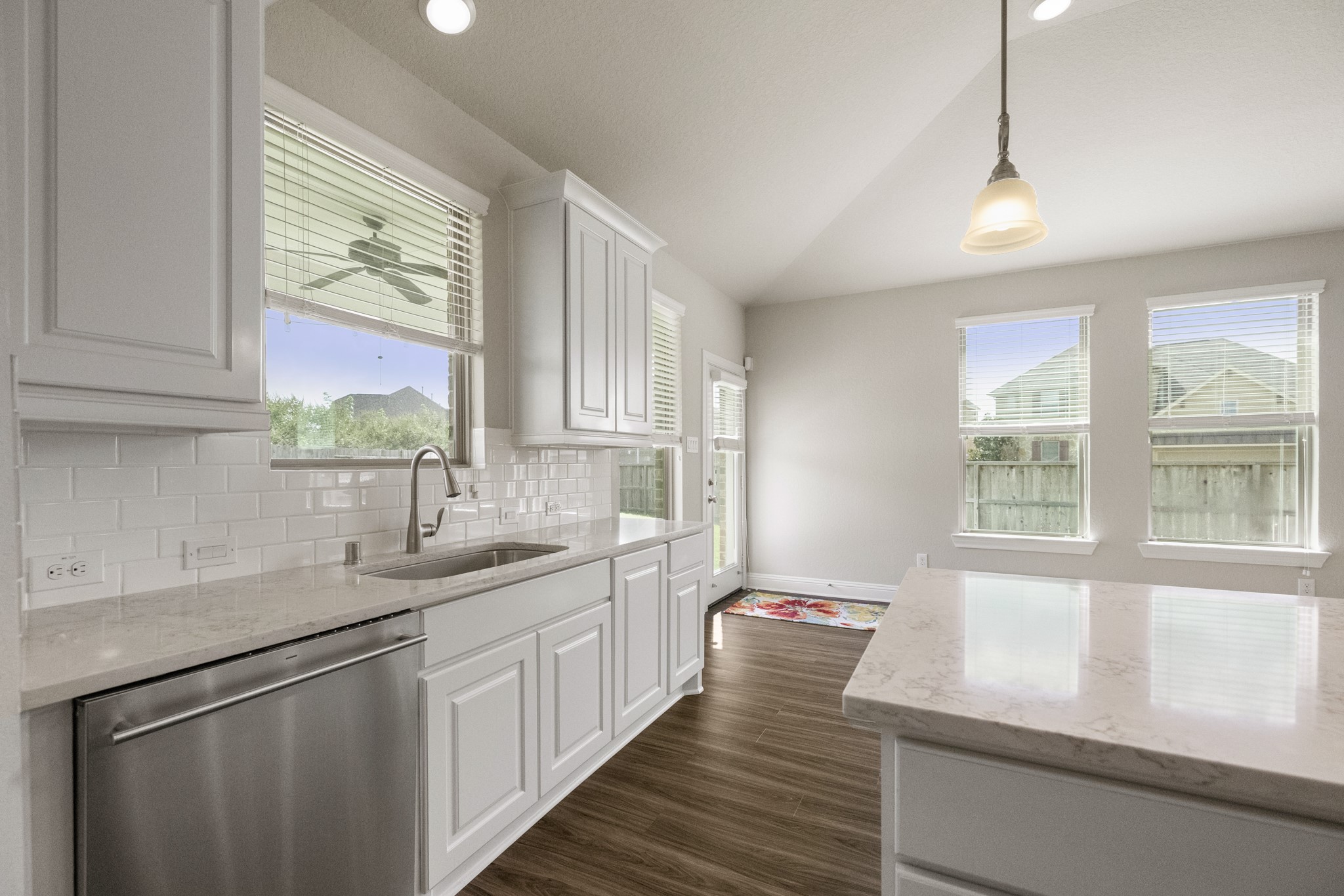 7502 Windsor Park Court Spring, TX 77379 - Photo 16 of 50 a kitchen with a sink window and cabinets