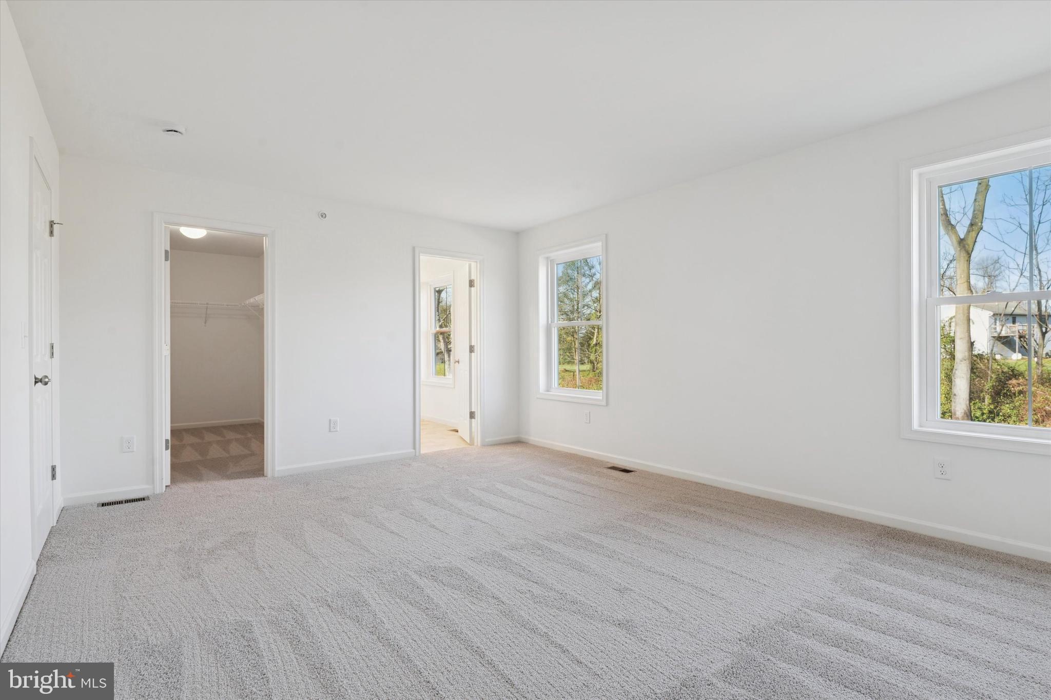 144 Silversmith Road Oxford, PA 19363 - Photo 5 of 20 an empty room with windows and closet