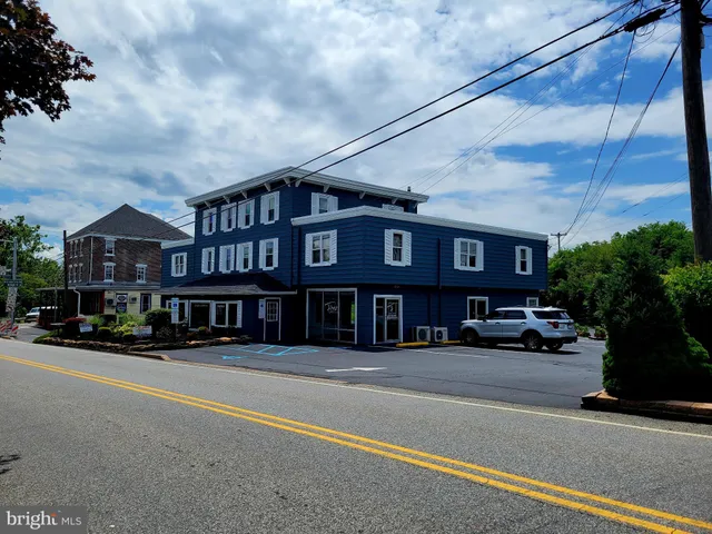 a front view of a building with street view