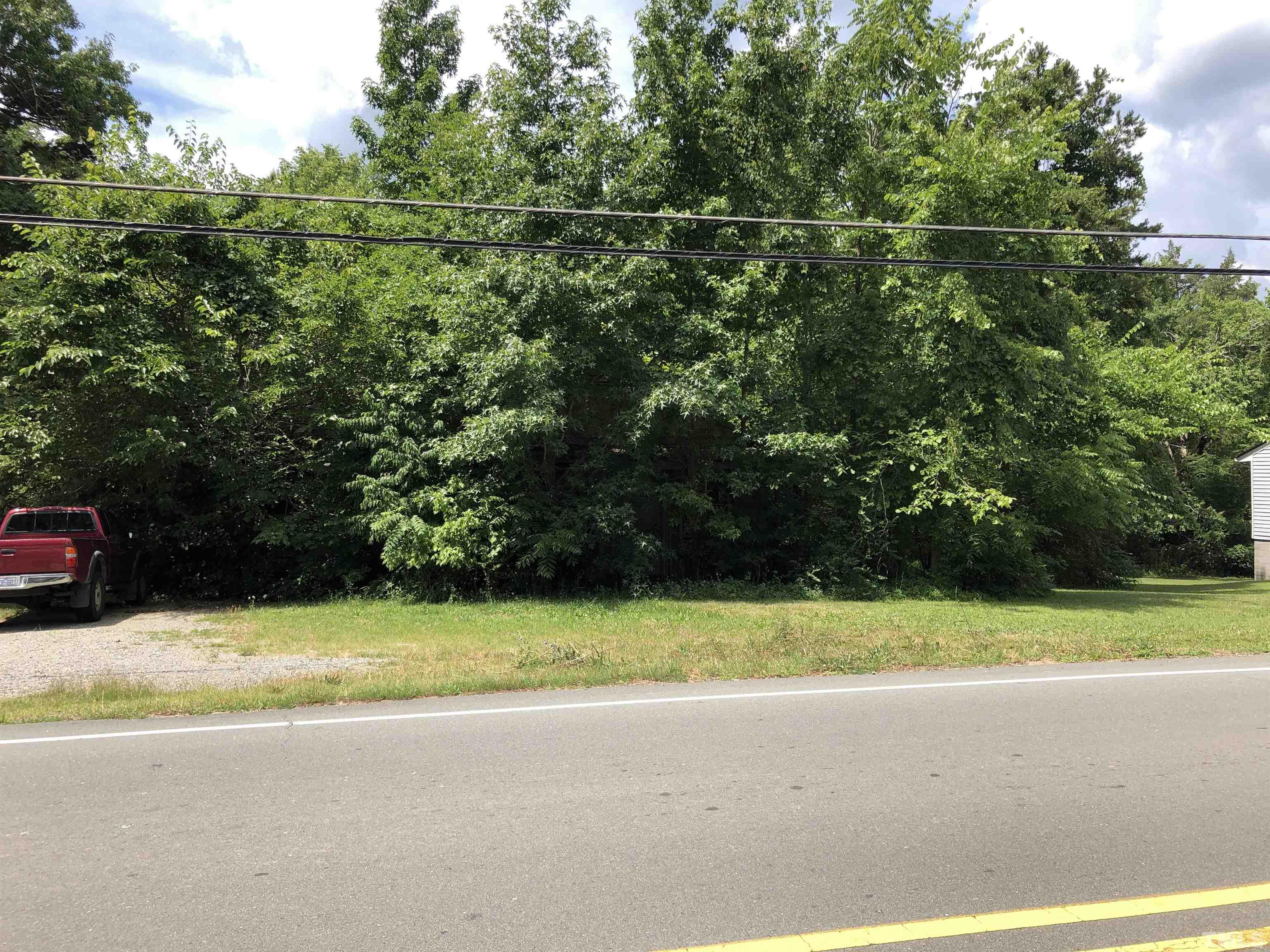 277 Cavel Chub Lake Road Roxboro, NC 27574 - Photo 3 of 24 a view of a swimming pool and a yard