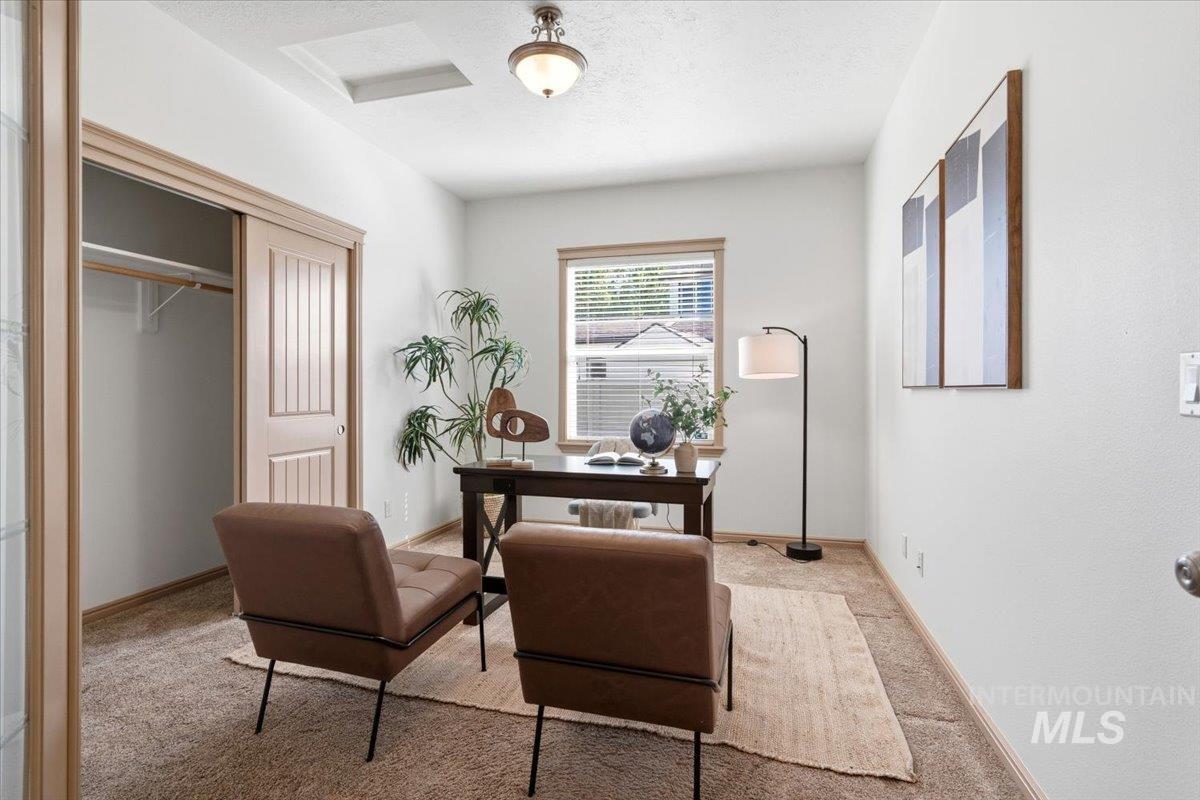 1183 North Buffalo Way Middleton, ID 83644 - Photo 22 of 47 Spacious room featuring neutral carpeting, a window with horizontal blinds, and a built-in closet with sliding panel doors