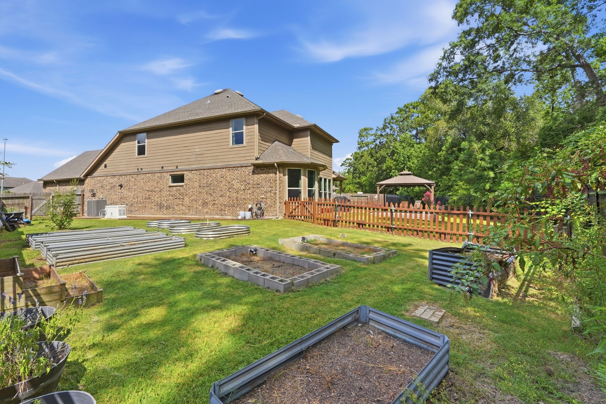 4337 Heavenly Woods Dr Spring Spring, TX 77386 - Photo 35 of 38 Side yard has containers ready for your green thumb to garden food or plants!