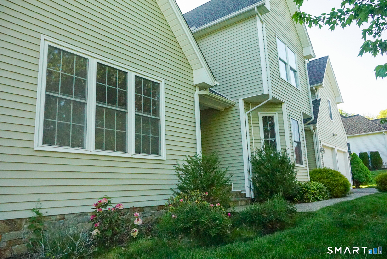 33 Knoll Ridge Court Middletown, CT 06457 - Photo 3 of 40 a view of a house with a yard and potted plants