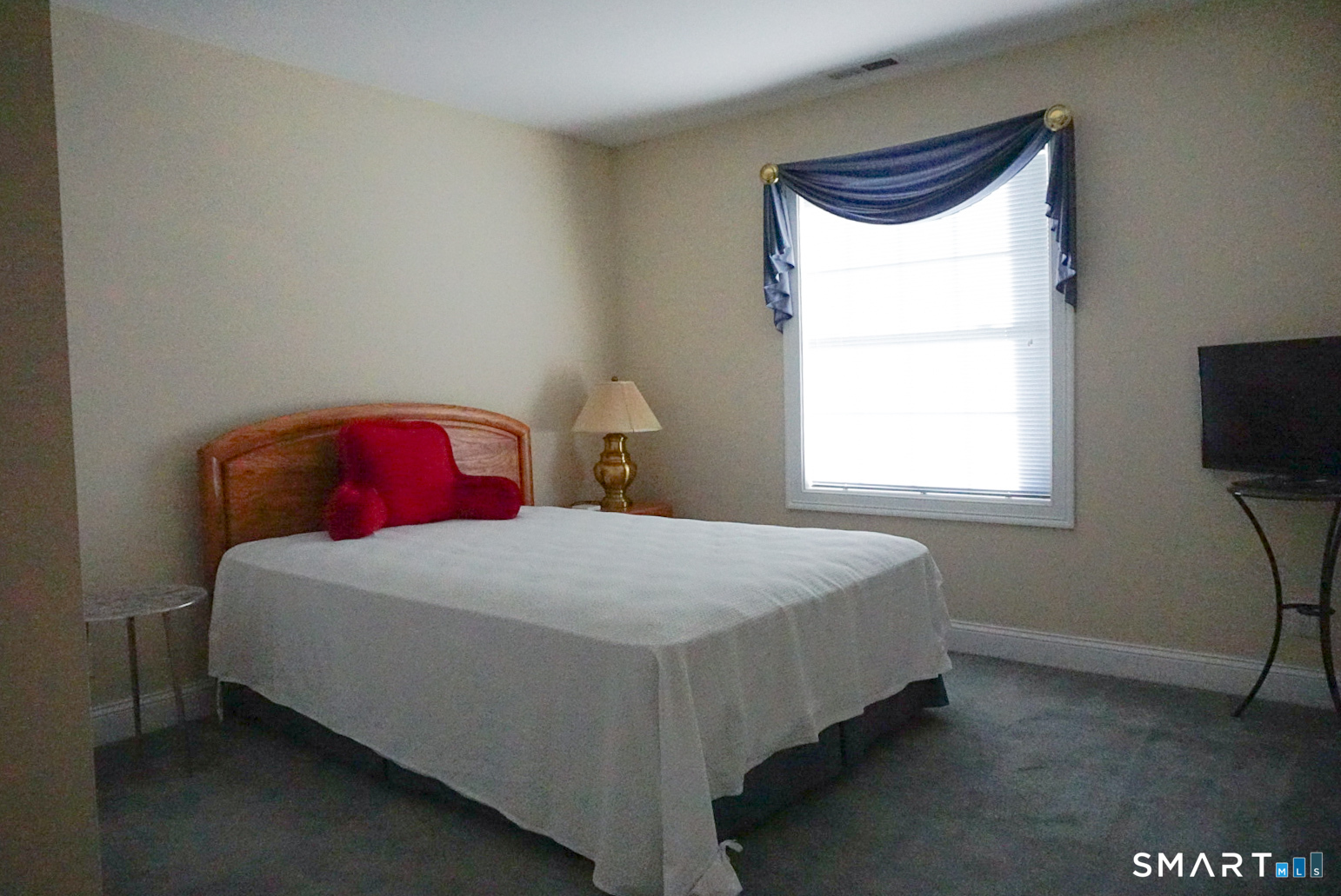 33 Knoll Ridge Court Middletown, CT 06457 - Photo 35 of 40 a bedroom with a bed and a window