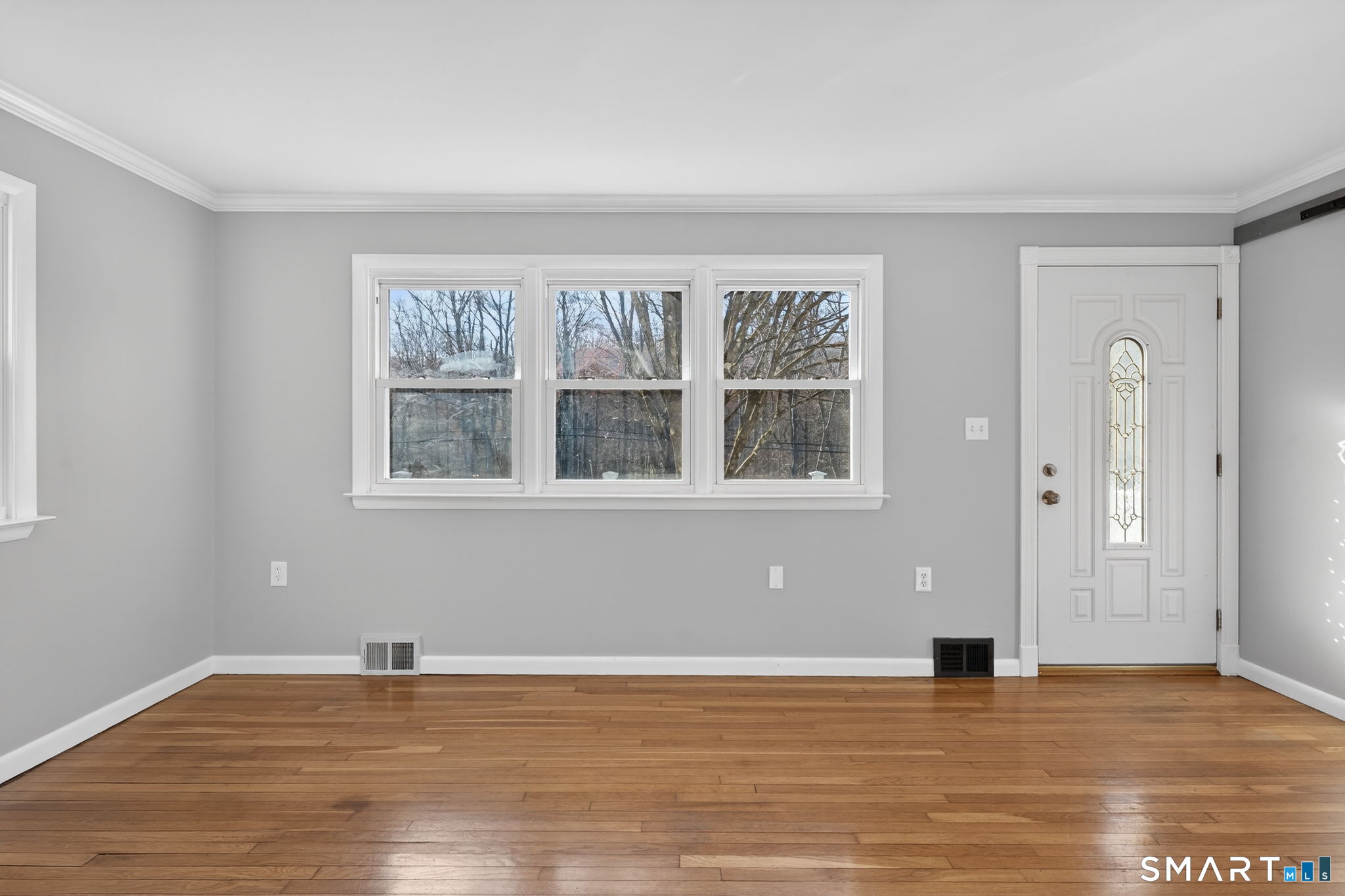 23 Holbrook Road Seymour, CT 06483 - Photo 11 of 53 a view of an empty room with wooden floor and a window