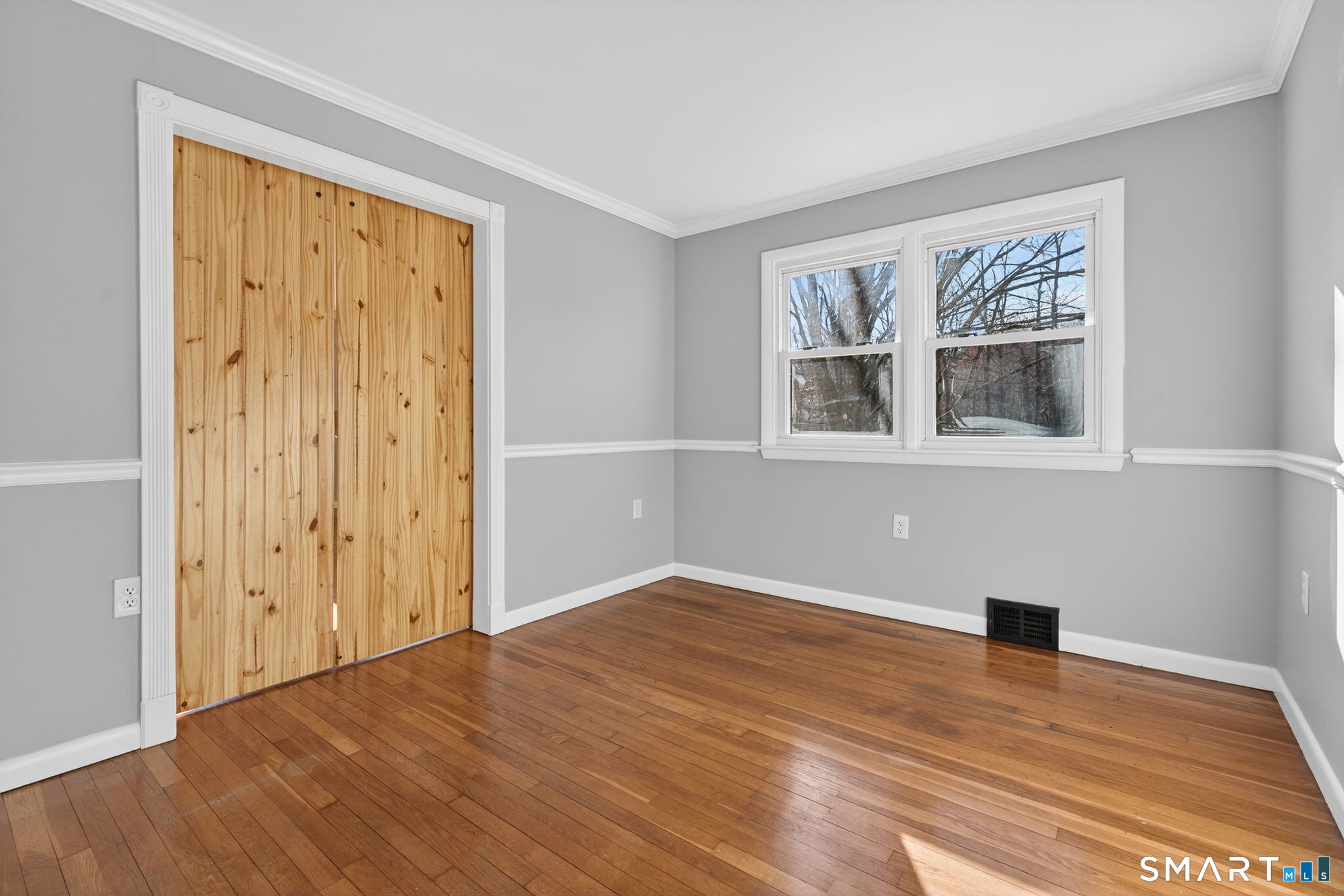 23 Holbrook Road Seymour, CT 06483 - Photo 18 of 53 a view of an empty room with wooden floor and a window