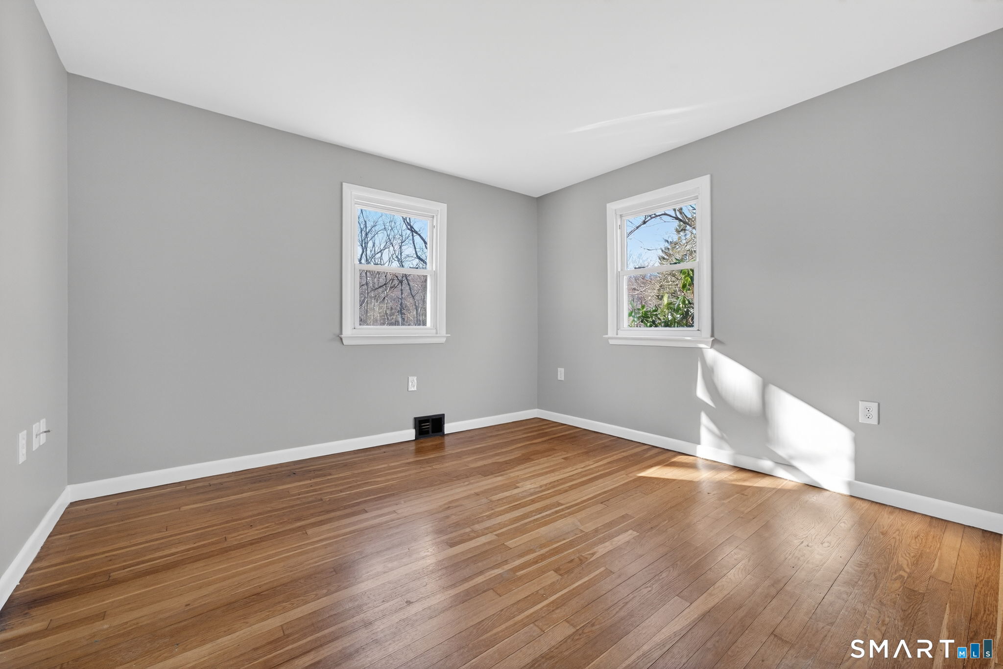 23 Holbrook Road Seymour, CT 06483 - Photo 22 of 53 an empty room with wooden floor and windows