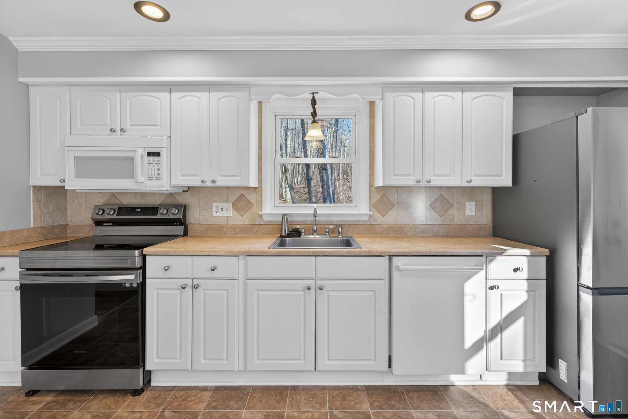23 Holbrook Road Seymour, CT 06483 - Photo 4 of 53 a kitchen with white cabinets and a sink