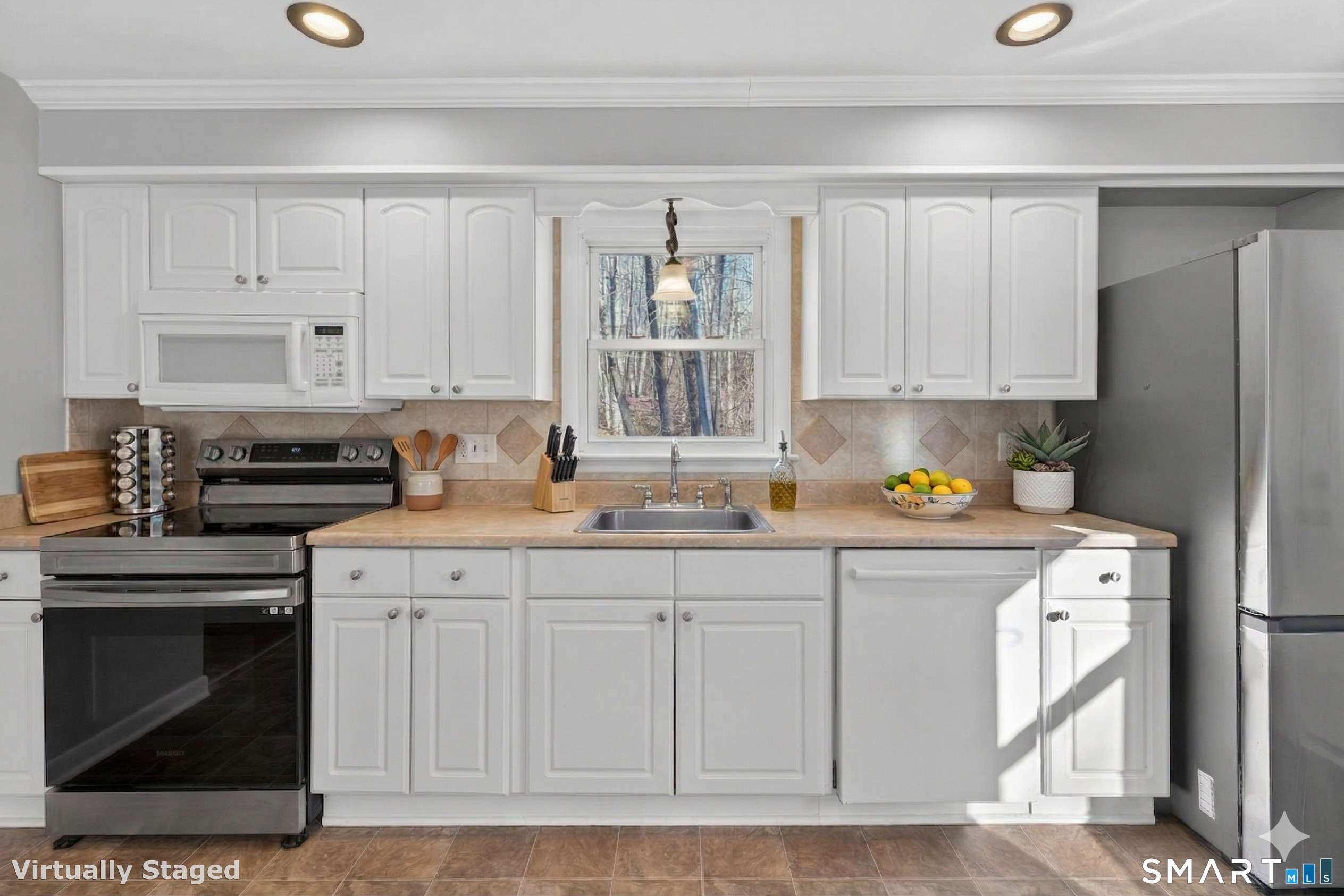 23 Holbrook Road Seymour, CT 06483 - Photo 5 of 53 a kitchen with stainless steel appliances granite countertop a stove a sink and a refrigerator