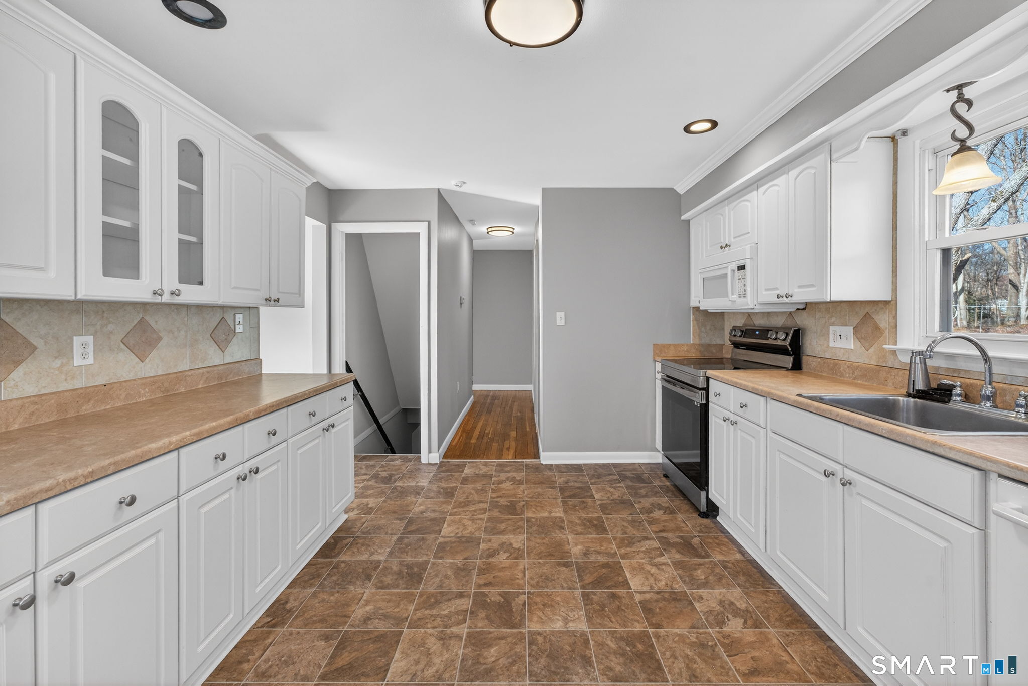 23 Holbrook Road Seymour, CT 06483 - Photo 9 of 53 a kitchen with white cabinets and sink