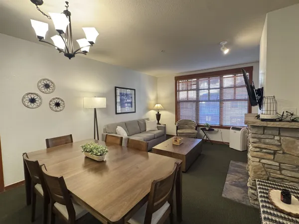 a kitchen with granite countertop a stove top oven microwave and cabinets