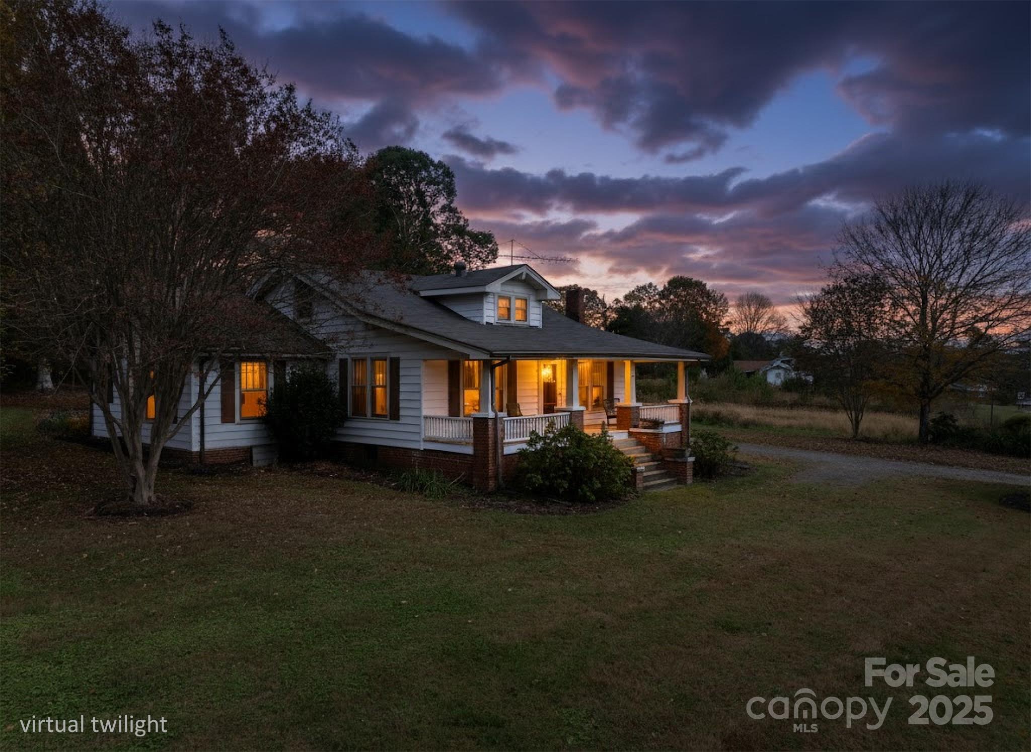 4541 Hartland Road Lenoir, NC 28645 - Photo 19 of 40 a view of a house with a yard