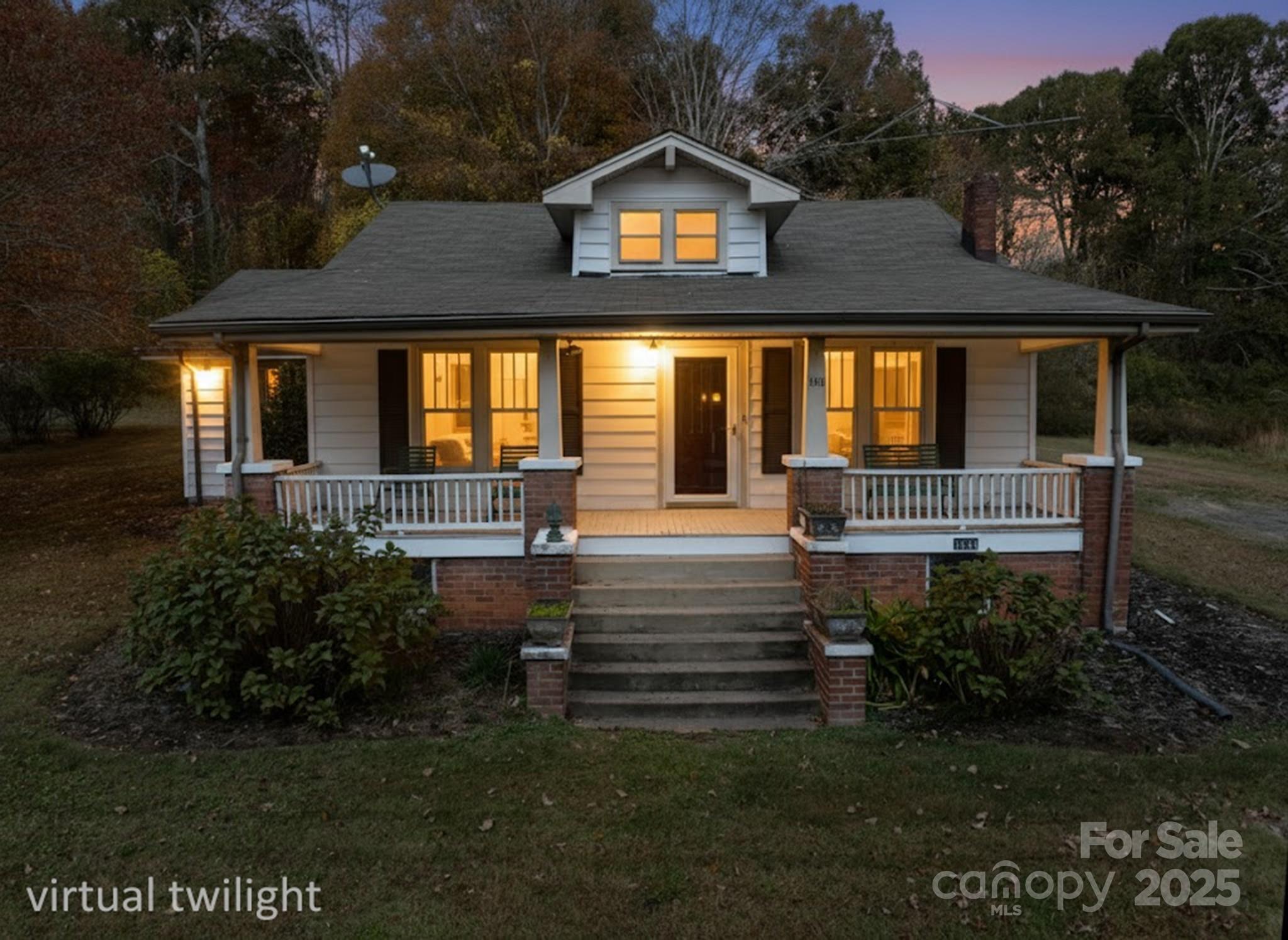 4541 Hartland Road Lenoir, NC 28645 - Photo 2 of 40 a front view of a house with a yard