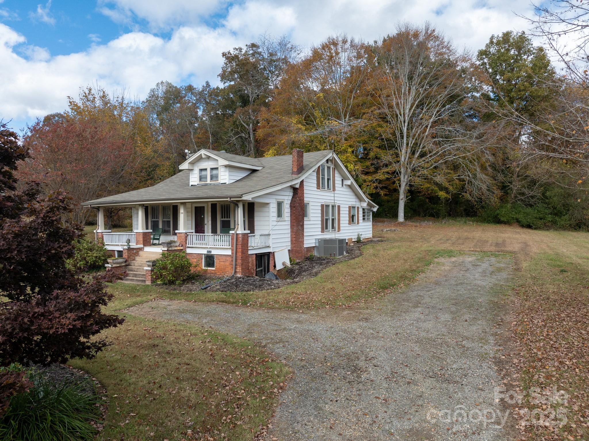 4541 Hartland Road Lenoir, NC 28645 - Photo 22 of 40 a front view of a house with a yard