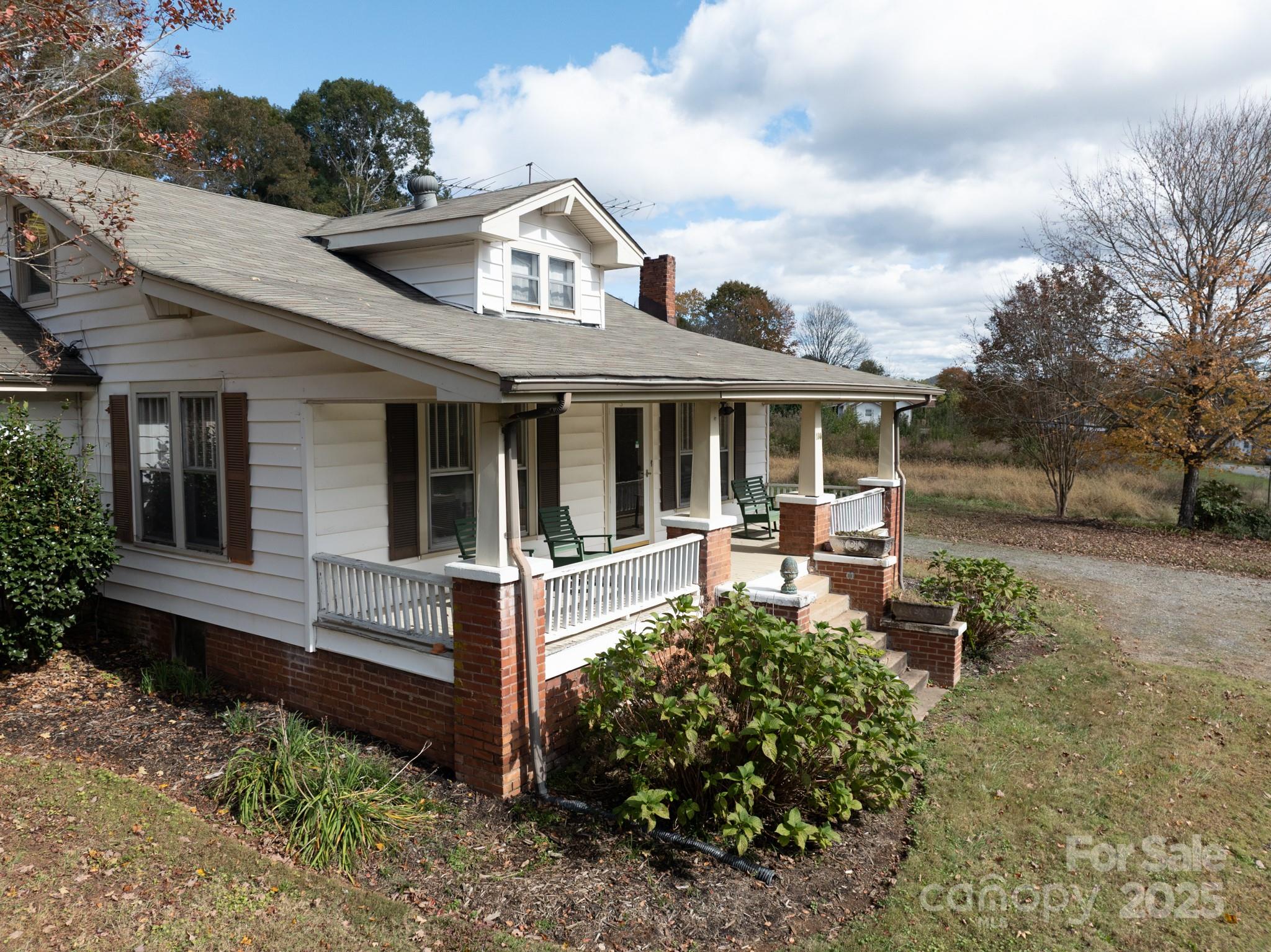 4541 Hartland Road Lenoir, NC 28645 - Photo 29 of 40 a view of a house with a yard and sitting area