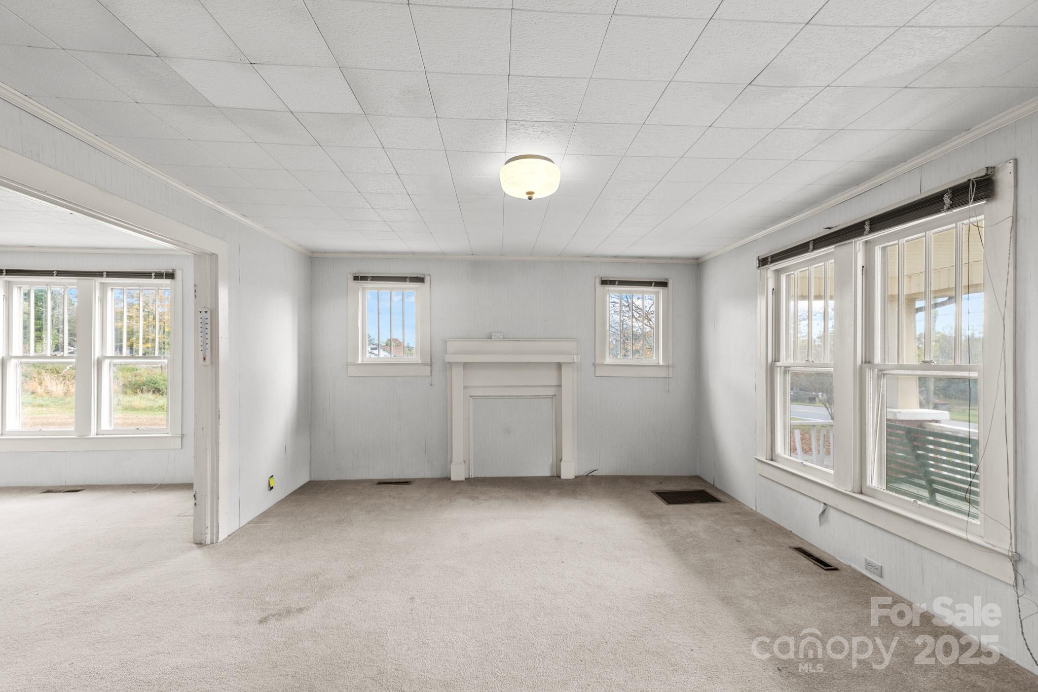 4541 Hartland Road Lenoir, NC 28645 - Photo 3 of 40 a view of an empty room with a window