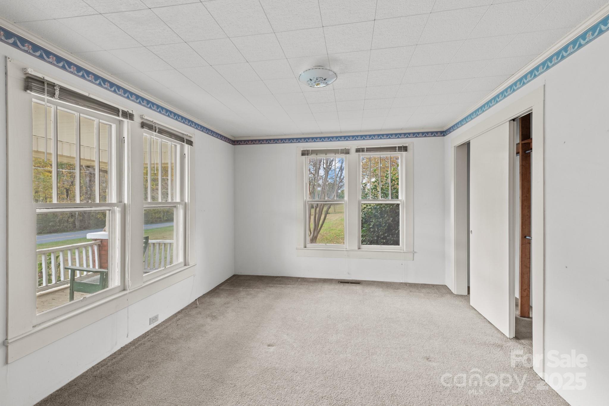 4541 Hartland Road Lenoir, NC 28645 - Photo 4 of 40 an empty room with a window