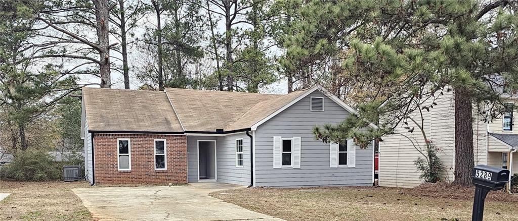 a house with trees in the background