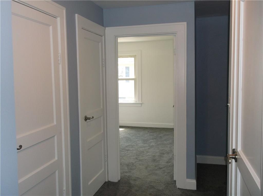 420 Rostraver Road Belle Vernon, PA 15012 - Photo 12 of 25 This is the hallway from one bedroom to the bath and second bedroom on the main floor. There's also two closets for all of your linens!