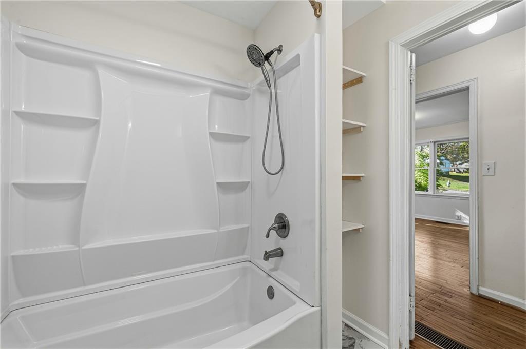 2583 Joyce Avenue Decatur, GA 30032 - Photo 14 of 30 a bathroom with a bath tub