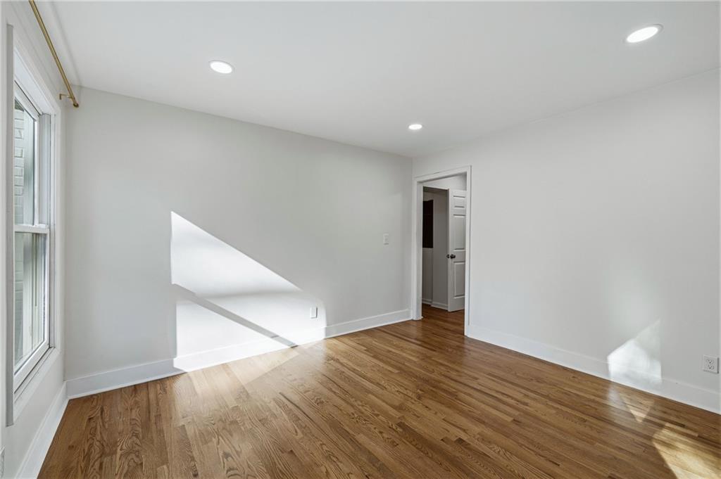 2583 Joyce Avenue Decatur, GA 30032 - Photo 16 of 30 an empty room with wooden floor and windows