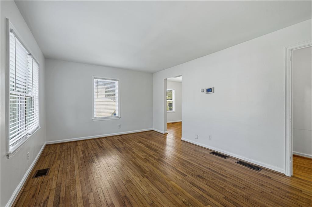 2583 Joyce Avenue Decatur, GA 30032 - Photo 18 of 30 an empty room with wooden floor and windows