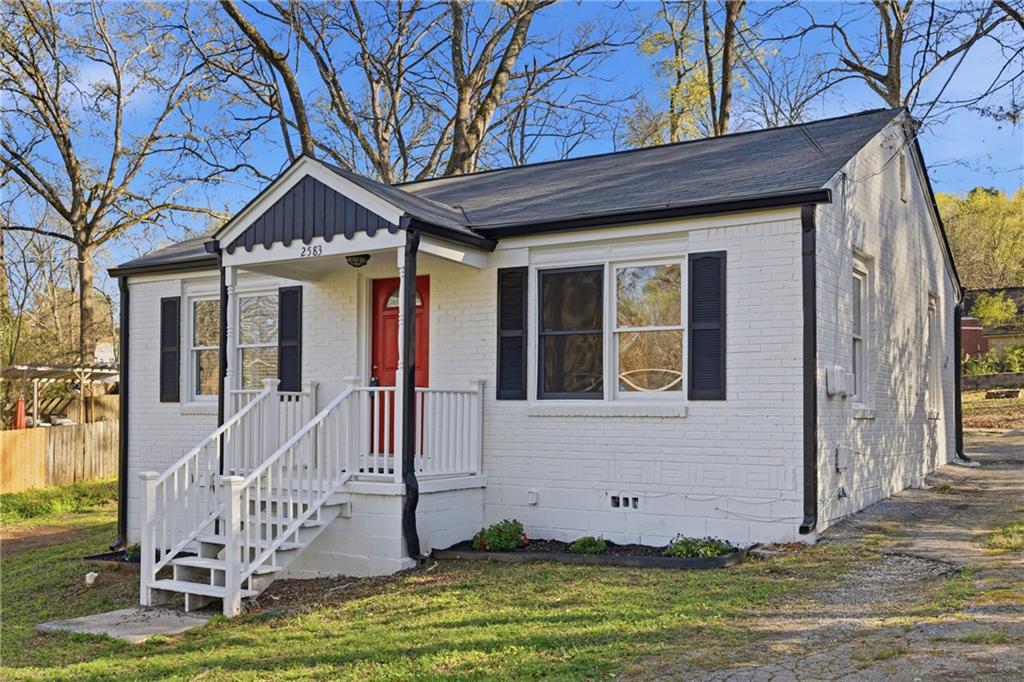 2583 Joyce Avenue Decatur, GA 30032 - Photo 2 of 30 a front view of a house with a yard