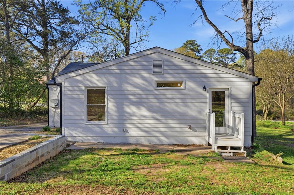 2583 Joyce Avenue Decatur, GA 30032 - Photo 3 of 30 a front view of a house with a yard