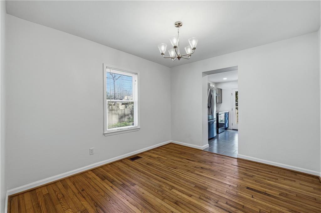 2583 Joyce Avenue Decatur, GA 30032 - Photo 7 of 30 a view of empty room with wooden floor and fan