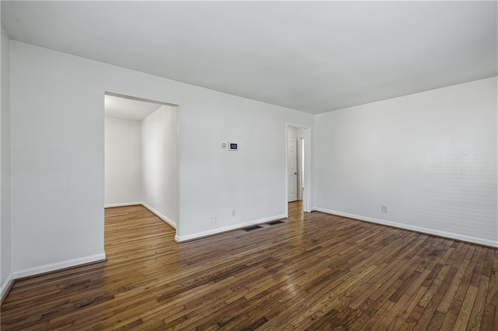 2583 Joyce Avenue Decatur, GA 30032 - Photo 10 of 30 a view of an empty room with wooden floor