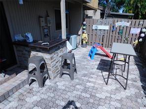 2156 Southwest 82nd Avenue, Unit 2156 Davie, FL 33324 - Photo 17 of 24 a view of an chairs and tables in the patio
