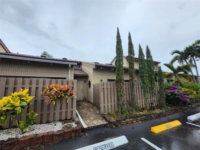 a front view of a house with yard