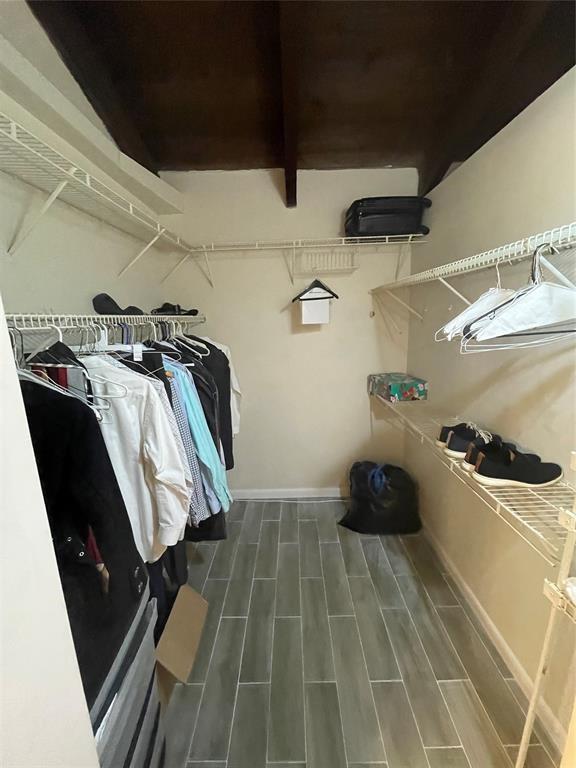 2156 Southwest 82nd Avenue, Unit 2156 Davie, FL 33324 - Photo 21 of 24 a view of walk in closet with clothes and shoes