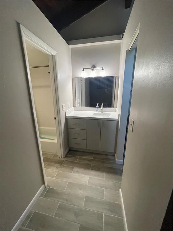 2156 Southwest 82nd Avenue, Unit 2156 Davie, FL 33324 - Photo 22 of 24 a view of an empty room with wooden floor and a window