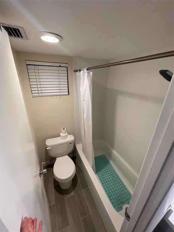 2156 Southwest 82nd Avenue, Unit 2156 Davie, FL 33324 - Photo 23 of 24 a bathroom with a toilet and a shower